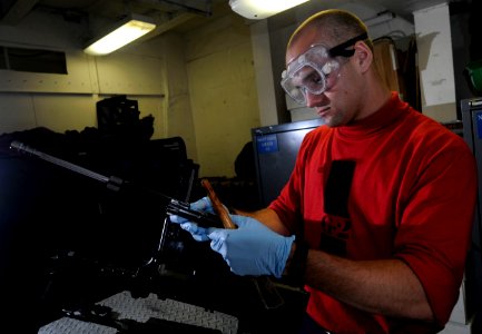 US Navy 110519-N-GZ277-023 Gunner's Mate Seaman John Baughman, assigned to the weapons department of the Nimitz-class aircraft carrier USS Carl Vin