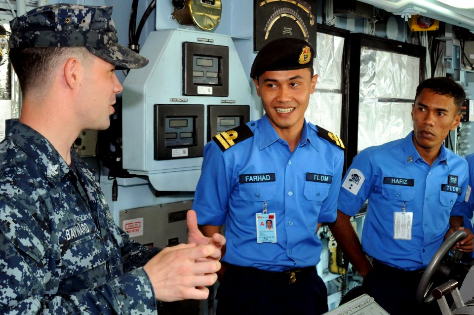 US Navy 110518-N-SP676-042 Mineman 2nd Class Dana Baynard explains daily bridge operations aboard the mine countermeasures ship USS Avenger (MCM 1)