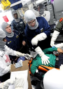 US Navy 110516-N-XE109-071 Chief Hospital Corpsman Kelly M. Miller conducts training during a general quarters drill aboard USS George H.W. Bush (C