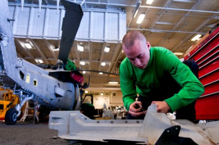 US Navy 110517-N-BT887-150 Aviation Electronics Technician 3rd Class Stephen Hesch, from Las Vegas, tags a piece of equipment during a phase