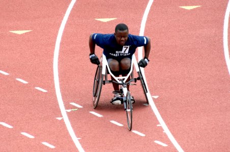 US Navy 110517-N-CD297-044 Team Navy-Coast Guard member Aviation Ordnanceman 2nd Class Selemani Johnson warms-up before participating in the 200-me