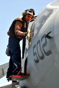 US Navy 110520-N-1004S-575 Aviation Machinist Mate Airman Scott Hallock cleans the cockpit shield of an EA-6B Prowler aboard the aircraft carrier R