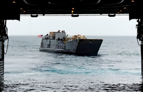 US Navy 110519-F-HS649-055 Landing Craft Utility (LCU) 1665 exits the well deck of the amphibious transport dock ship USS Cleveland (LPD 7) during