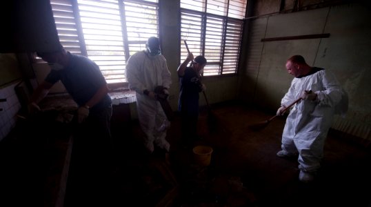 US Navy 110517-N-TU221-254 Sailors clean a room of debris inside an abandoned building at Hospicio De San Jose Orphanage during a community service