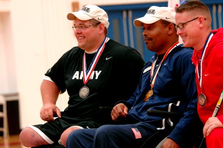 US Navy 110519-N-CD297-022 Retired Boatswain's Mate 1st Class Andre C. Shelby from Team Navy-Coast Guard poses with other medal winners of the comp