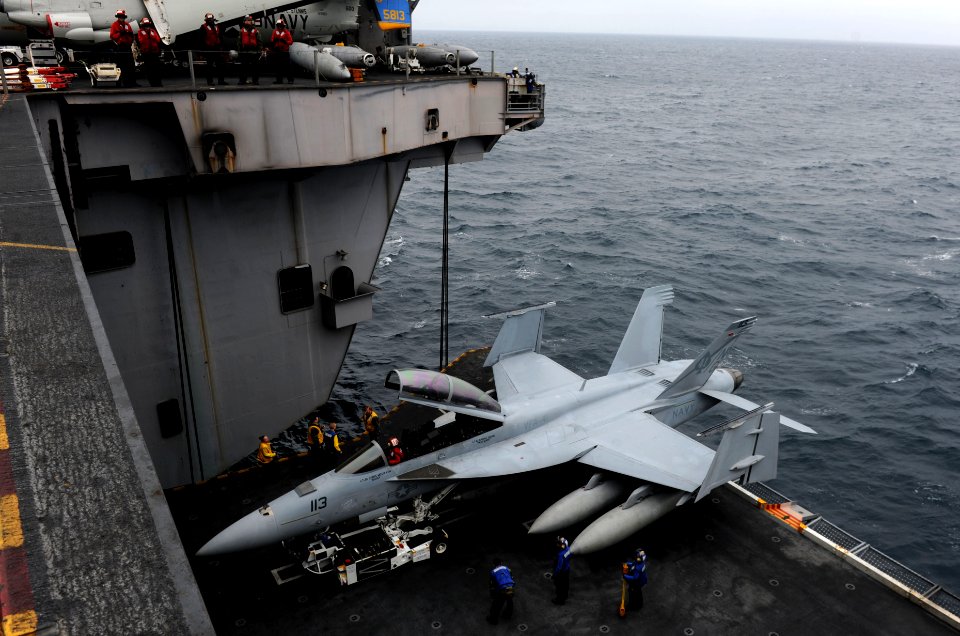 US Navy 110520-N-OY799-168 An F-A-18F Super Hornet from the Black Aces of Strike Fighter Squadron (VFA) 41 is parked on aircraft elevator three abo