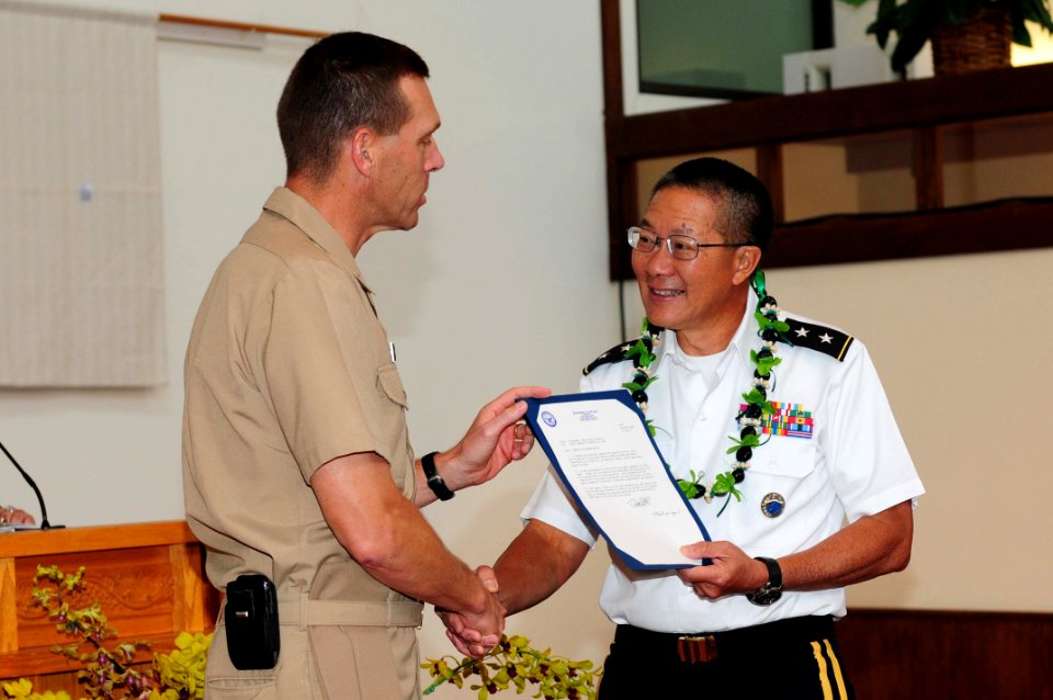 US Navy 110518-N-KT462-689 Rear Adm. Dixon R. Smith presents presents Maj. Gen. Stephen Tom with a letter of appreciation