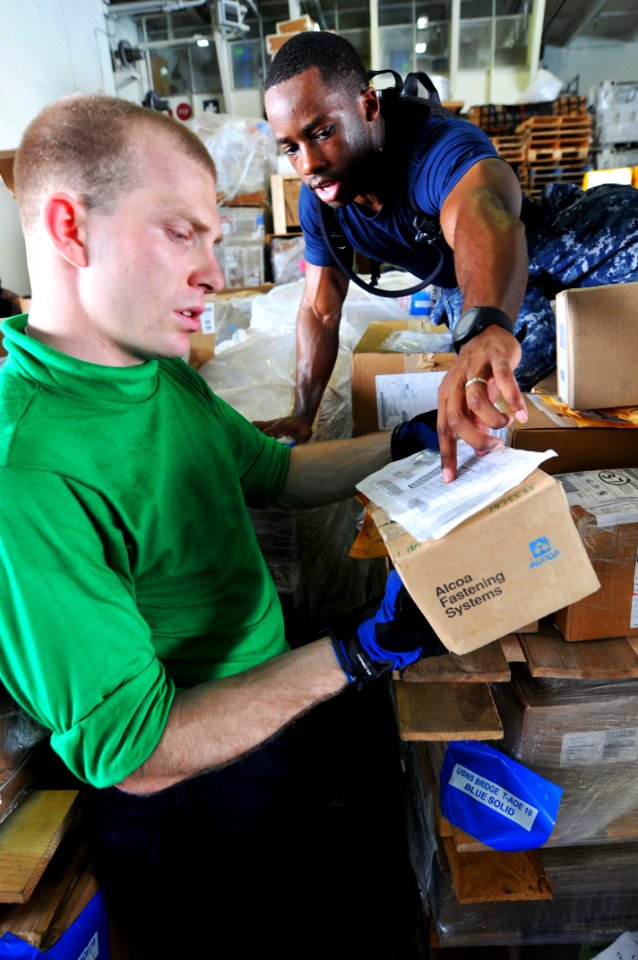 US Navy 110519-N-1004S-135 Logistics Specialist 2nd Class Tarence Pauldon, from Bronx, N.Y., shows Logistics Specialist Seaman Recruit Robert Vaugn