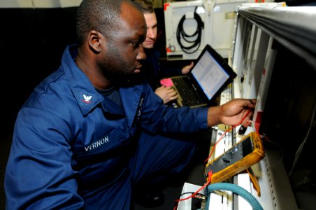 US Navy 110518-N-QL471-274 Aviation Support Equipment Technician 3rd Class Lionell T. Vernon, assigned to the aviation intermediate maintenance dep
