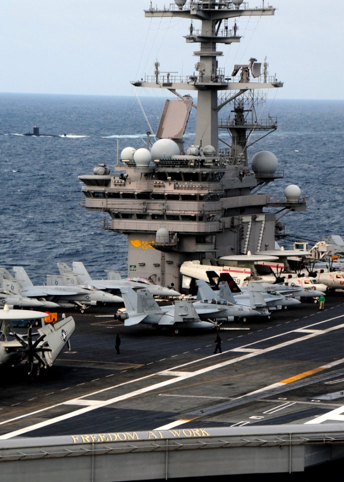 US Navy 110520-N-VQ827-597 The Royal Navy Trafalgar-class submarine HMS Torbay (S90) can be seen starboard of the aircraft carrier USS George H.W