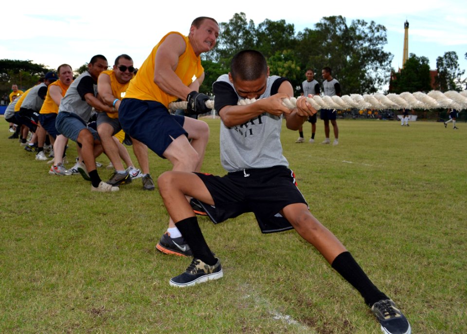 US Navy 110519-N-VA590-379 Seaman Daniel Williams and a Royal Thai Navy sailor participate in the tug-o-war during Sports Day at Nong Prue Municipa