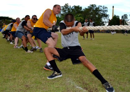 US Navy 110519-N-VA590-379 Seaman Daniel Williams and a Royal Thai Navy sailor participate in the tug-o-war during Sports Day at Nong Prue Municipa photo