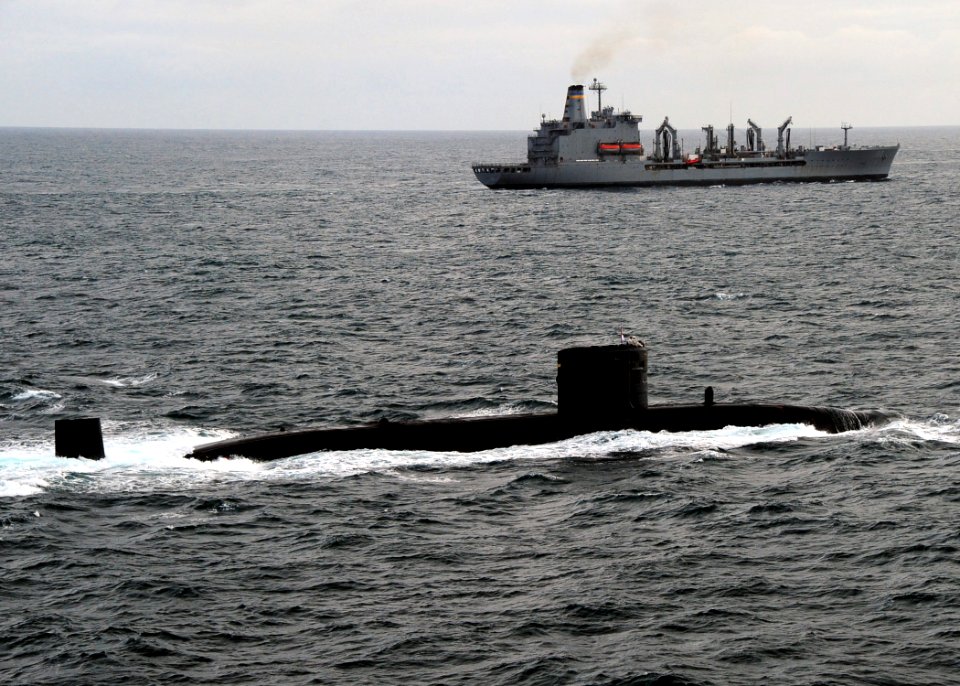 US Navy 110520-N-VQ827-895 The Royal Navy Trafalgar-class submarine HMS Torbay (S90) is underway in formation with the Military Sealift Command fle