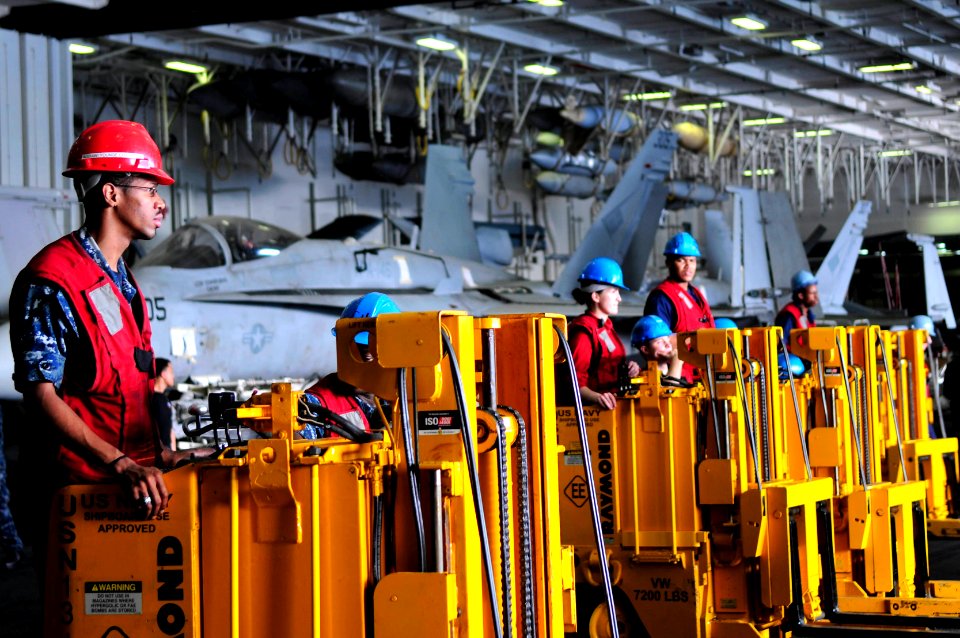 US Navy 110519-N-DM338-257 Sailors stand by to move cargo as it arrives from Military Sealift Command fast combat support ship USNS Bridge (T-AOE 1