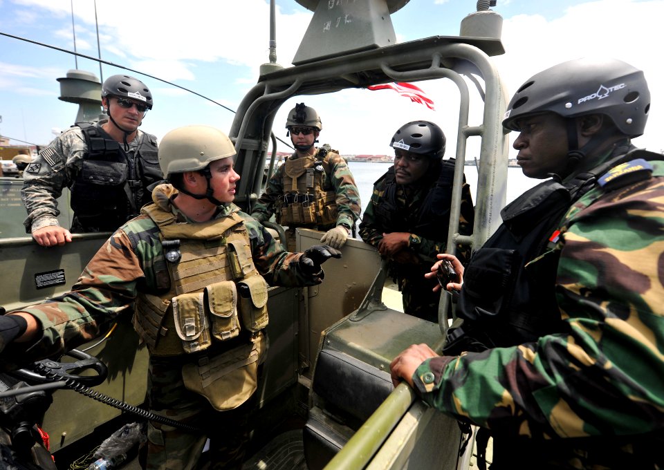 US Navy 110520-N-YO394-149 A Sailor from Riverine Squadron (RIVRON) 1 exchanges ideas for operations on a Riverine combat boat with officers from
