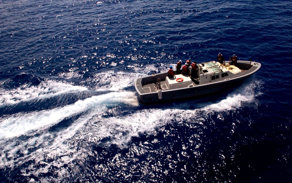 US Navy 110520-N-QP268-065 Sailors assigned to the amphibious dock landing ship USS Whidbey Island (LSD 41) use a landing craft, personnel large (L