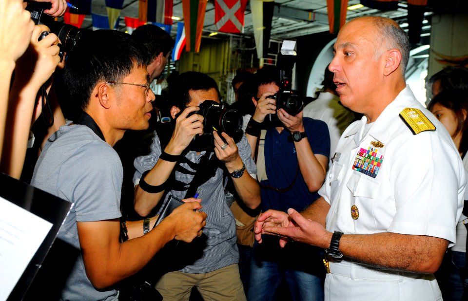 US Navy 110522-N-OK922-098 Rear Adm. Samuel Perez, commander of Carrier Strike Group 1, speaks to the media during a press conference in the hangar