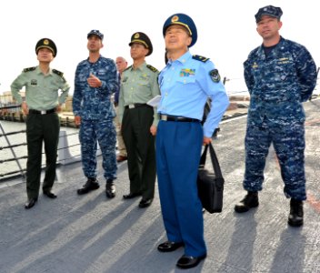 US Navy 110519-N-CI175-090 Fire Controlman 1st Class Nathan Schmidt speaks to officers from the Republic of China People's Liberation Army about th