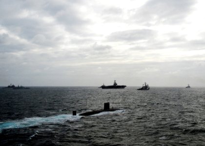 US Navy 110520-N-VQ827-880 The Royal Navy Trafalgar-class submarine HMS Torbay (S90) is underway in formation with the George H.W. Bush Carrier Str
