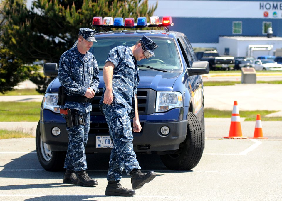 US Navy 110520-N-ZK021-009 Master-at-Arms 2nd Class Jerry Cotter, left, from Belding, Mich., assigned to base security, performs a mock field sobri