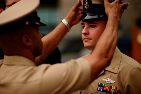 US Navy 110519-N-QF368-224 The 2011 U.S. Pacific Fleet Sailor of the Year Chief Hospital Corpsman Andrew Jenkins receives his chief cover during a