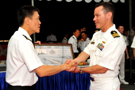 US Navy 110519-N-SF508-414 Cmdr. Steven DeMoss, right, commanding officer of the Arleigh Burke-class guided-missile destroyer USS McCampbell (DDG 8