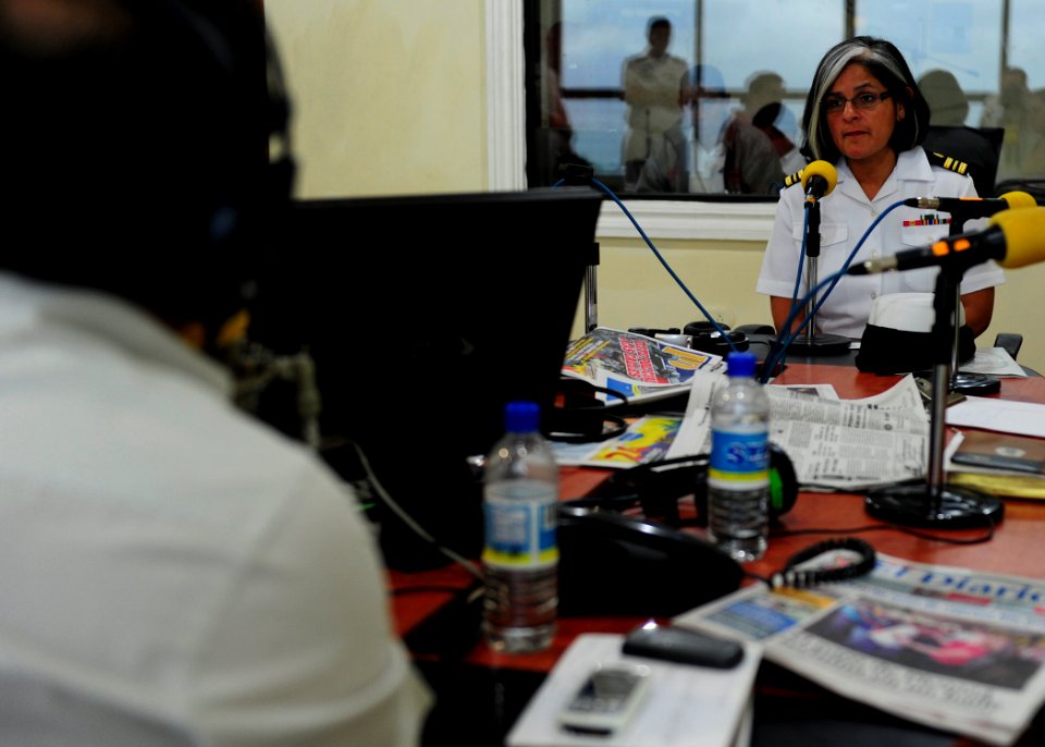 US Navy 110524-N-QD416-056 t. Cmdr. Jeanne Jimenez discusses the Continuing Promise 2011 mission with radio personalities during a live interview a