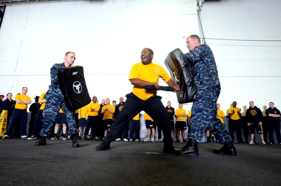 US Navy 110521-N-XE109-274 Aviation Ordnanceman Airman Ryan Grant strikes training bags during the second stage of a Navy Security Force Level 1 tr