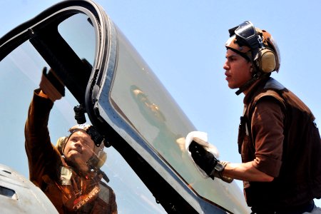 US Navy 110520-N-1004S-479 Sailors clean the cockpit shield of an EA-6B Prowler aboard the aircraft carrier Ronald Reagan (CVN 76)