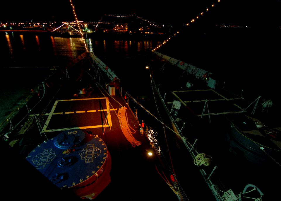 US Navy 110521-N-ZI300-017 The guided-missile frigates USS Boone (FFG 28) and Thach (FFG 43) display friendship lights while pierside during Gloria