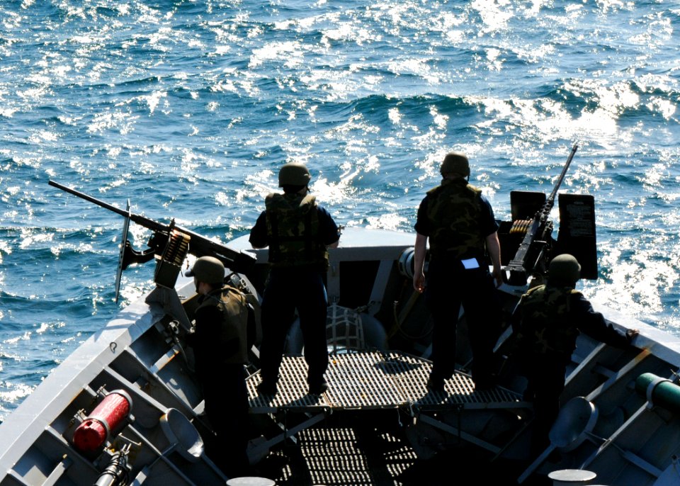 US Navy 110521-N-YM590-062 Sailors aboard USS Anzio (CG 68) stand watch on the ship's forecastle while transiting the Strait of Gibraltar