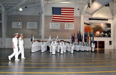 US Navy 110526-N-IK959-899 Capt. Steven Bethke, right, commanding officer of Recruit Training Command (RTC), walks with Capt. Clarence Carter, prof