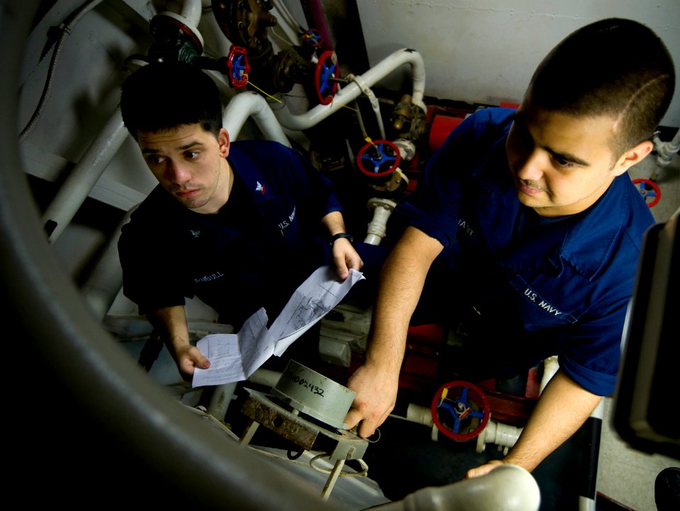 US Navy 110520-N-MD252-072 Sailors inspect an aqueous film forming foam injection station