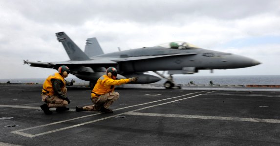 US Navy 110523-N-OY799-128 Shooters launch an F-A-18C Hornet