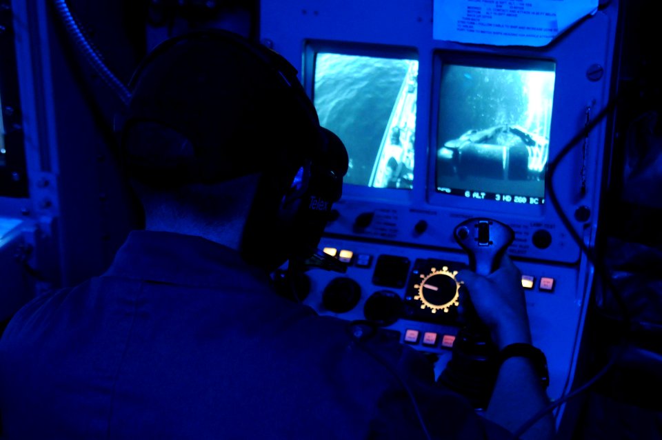 US Navy 110520-N-SP676-143 Mineman 2nd Class William Linehan operates the mine neutralization system from the combat information center aboard the