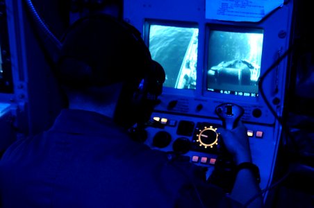 US Navy 110520-N-SP676-143 Mineman 2nd Class William Linehan operates the mine neutralization system from the combat information center aboard the