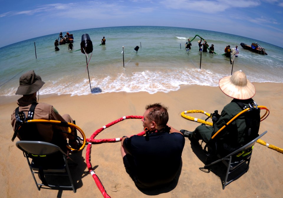 US Navy 110520-N-VF350-072 U.S. Navy Divers take a break during a Joint POW-MIA Accounting Command (JPAC) underwater recovery mission