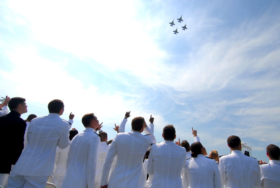 US Navy 110527-N-OA833-005 Midshipmen watch a flyover from the Pukin' Dogs of Strike Fighter Squadron (VFA) 143 during to the U.S. Naval Academy Cl