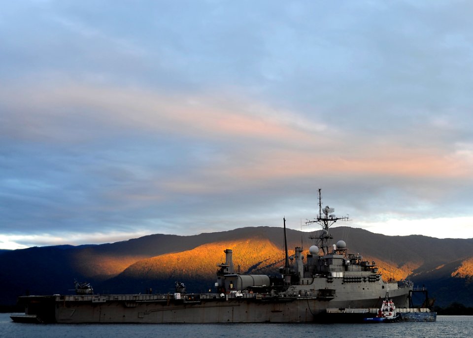 US Navy 110521-F-HS649-007 The amphibious transport dock ship USS Cleveland (LPD 7) is anchored off the coast of Papua New Guinea at dawn during th