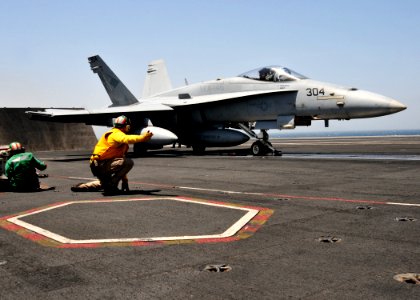 US Navy 110521-N-GL340-187 Lt. Cmdr. Bryan Bennett gives the signal to catapult an F-A-18C Hornet assigned to the Blue Diamonds of Strike Fighter S