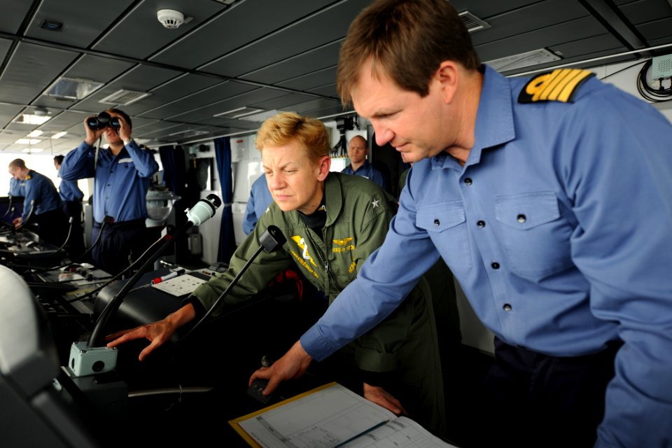 US Navy 110525-N-YZ751-029 Capt. Richard Powell, right, commanding officer of the Royal Navy destroyer HMS Dauntless (D33), gives a tour of the shi