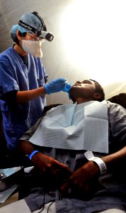 US Navy 110522-O-ZZ999-005 Lt. Hoan Nghiem prepares a patient for a tooth extraction during a Pacific Partnership 2011 medical civil action project