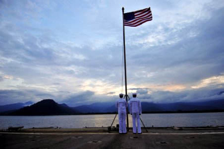 US Navy 110527-N-KB563-085 Information Systems Technician Seaman Dayne Kimmet, left, and Seaman Richard Valdez wait to perform evening colors aboar