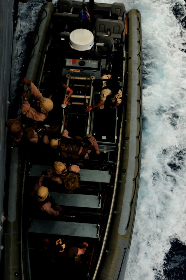 US Navy 110528-N-XO436-010 Marines assigned to the San Antonio-class amphibious transport dock ship USS Mesa Verde (LPD 19) board the Arleigh Burke