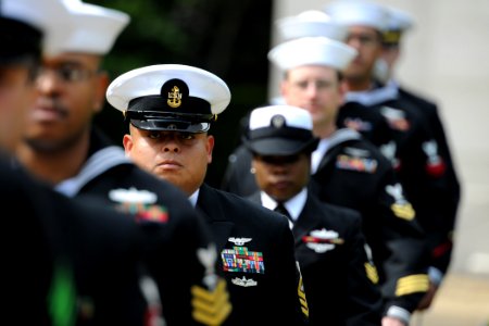 US Navy 110529-N-YZ751-100 Chief Aviation Electronics Technician Ricardo A. Garcia walks in formation at the conclusion of a Memorial Day service a