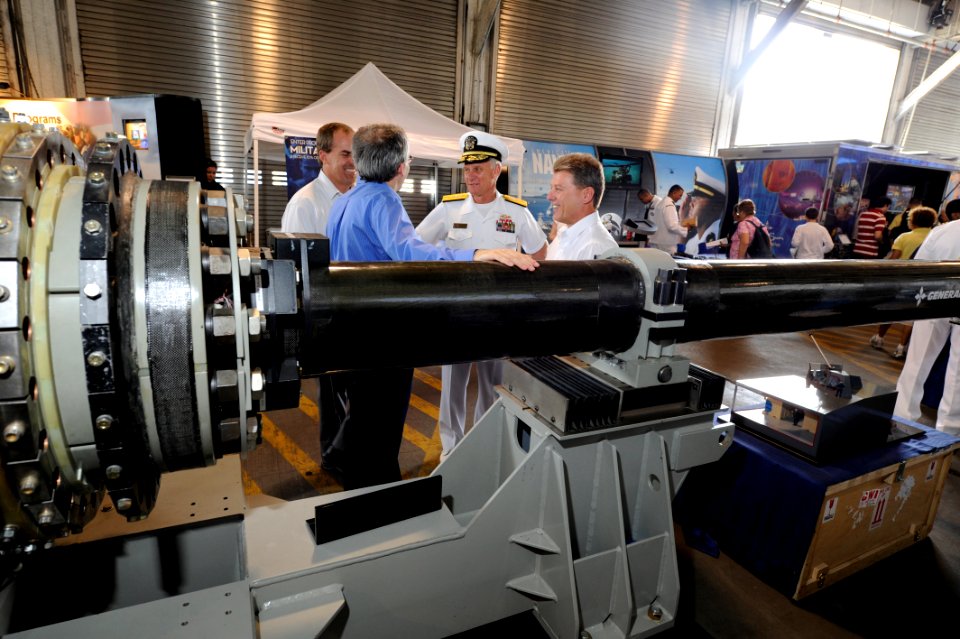 US Navy 110526-N-PO203-066 Rear Adm. Nevin P. Carr, Chief of Naval Research, speaks with research managers about the Railgun on display at Pier 88