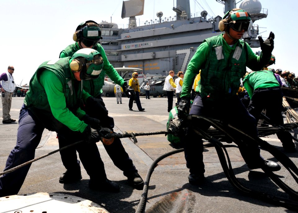 US Navy 110527-N-GL340-090 Sailors set up the emergency barricade during flight deck drills aboard USS Ronald Reagan (CVN 76)