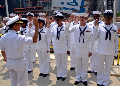 US Navy 110526-N-NN926-029 Rear Adm. Herm Shelanski, commander of Carrier Strike Group (CSG) 10, reenlists Sailors at Ground Zero in Manhattan duri
