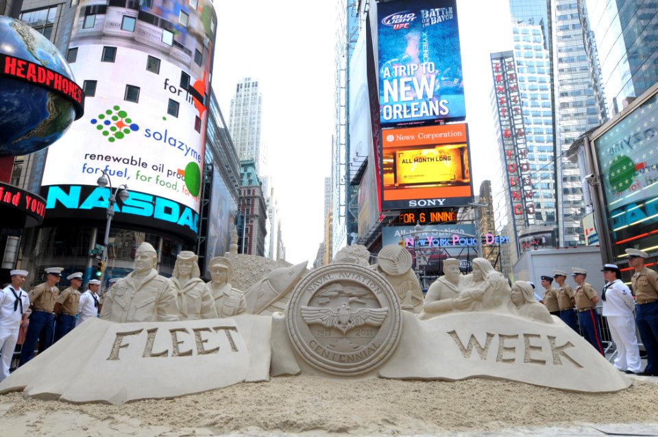 US Navy 110529-N-PS473-271 Service members surround a sand sculpture created for a special taping of the