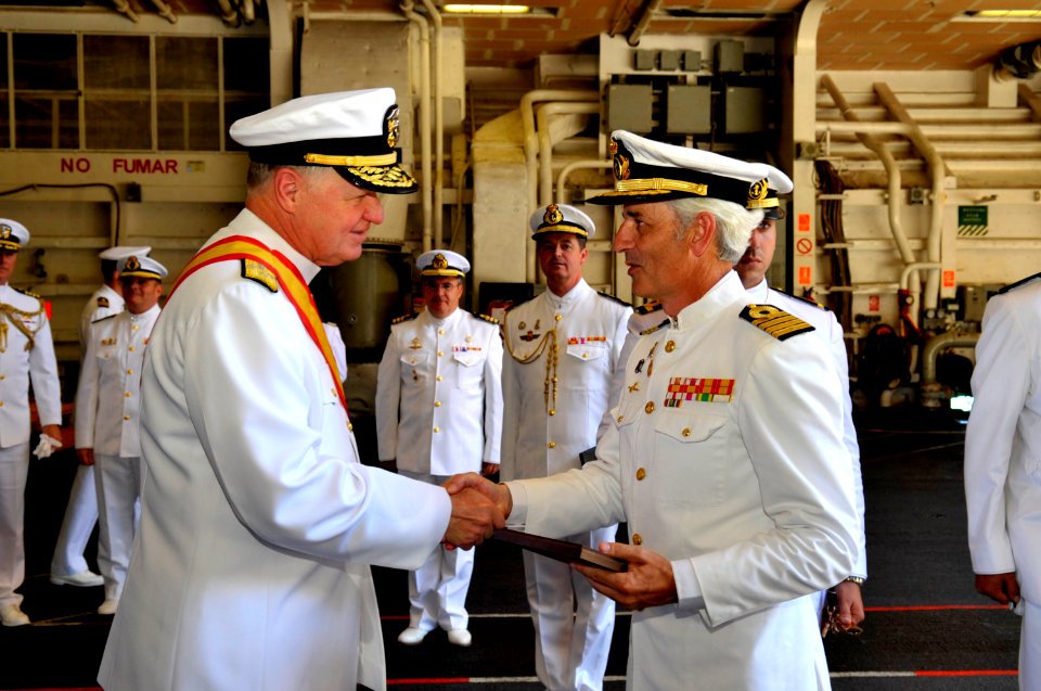 US Navy 110524-N-ZB612-430 Chief of Naval Operations (CNO) Adm. Gary Roughead presents a plaque to Capt. Gregorio Bueno